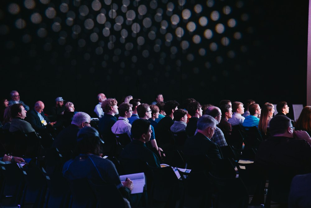 An audience listening at a policy briefing or conference